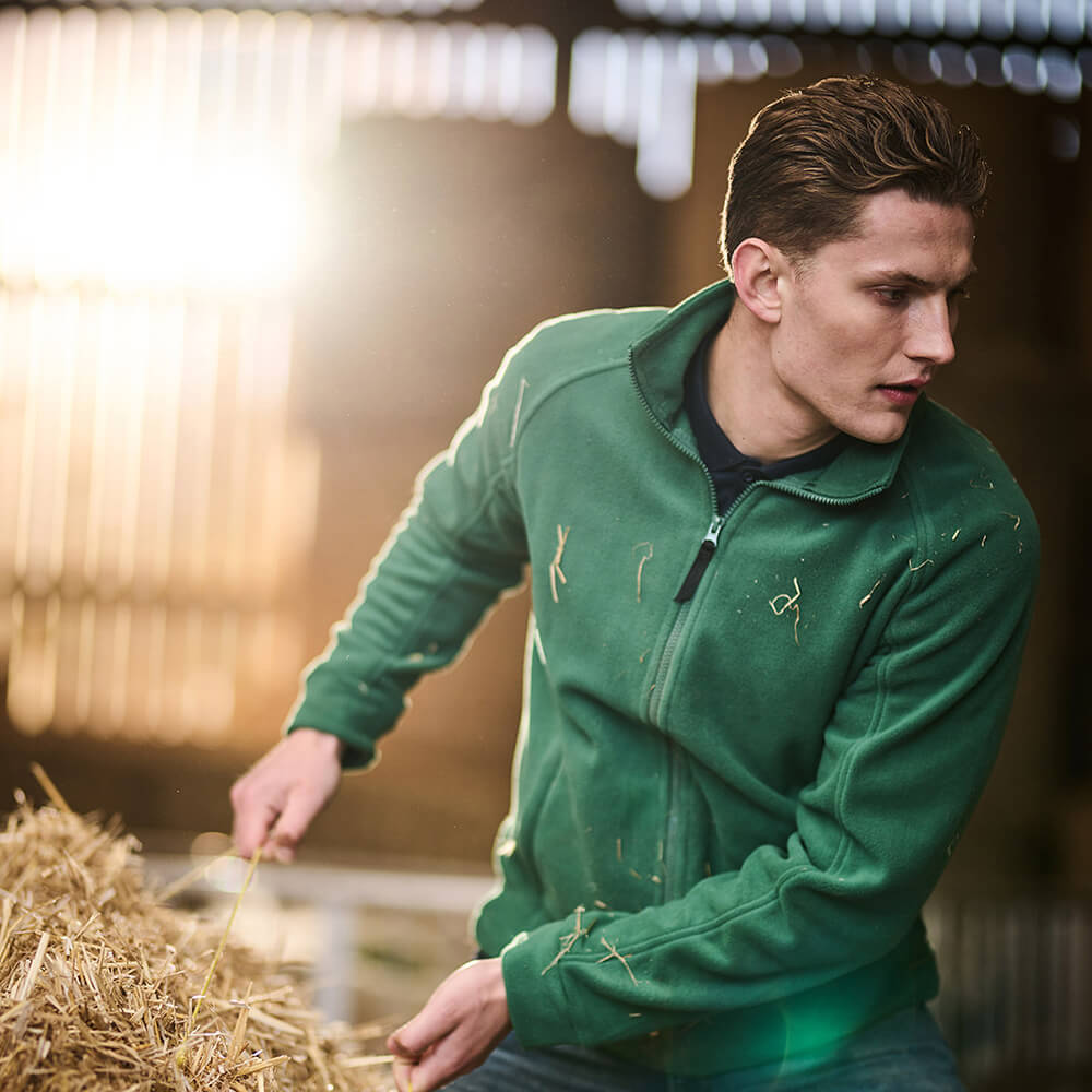 Man wearing a green zipped fleece