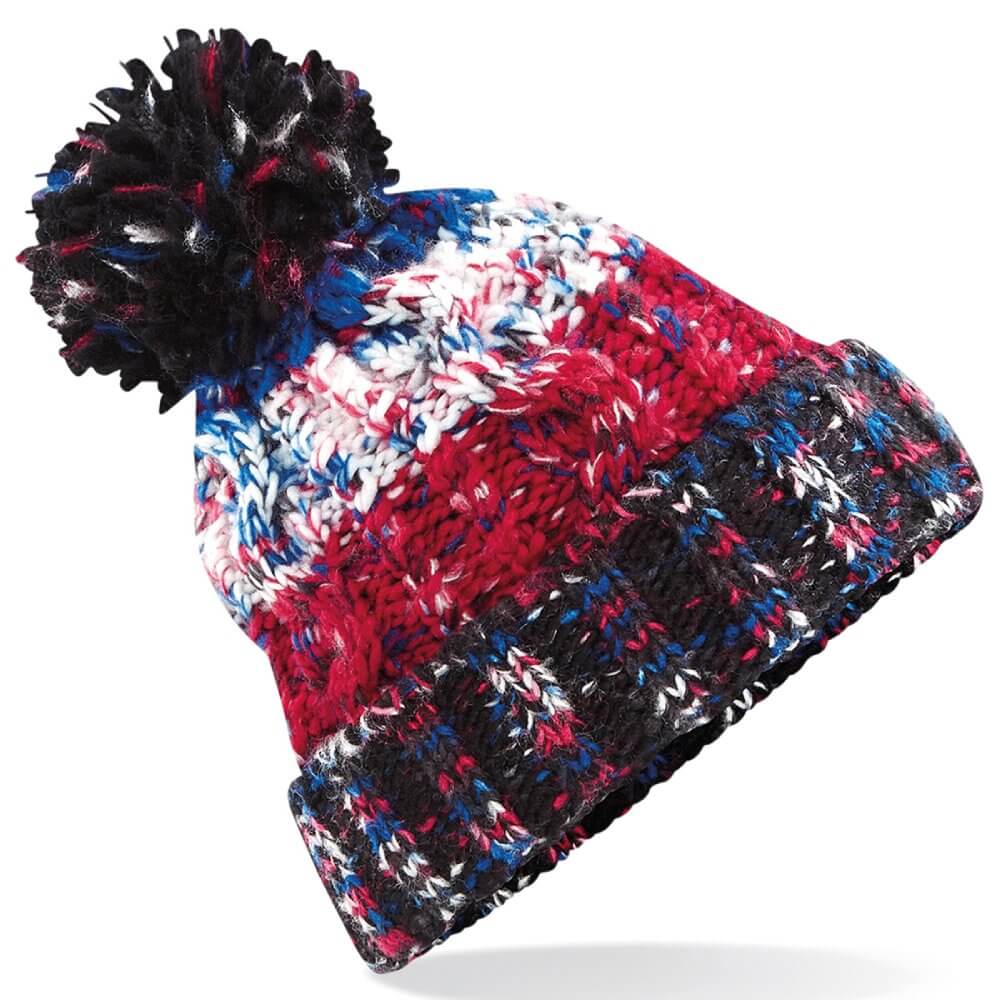 Close up of a corkscrew pom pom beanie